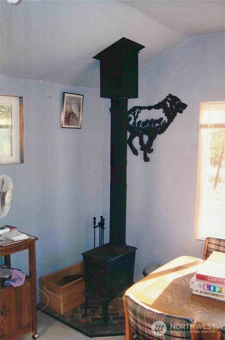 11300 South Stangland Road Medical Lake, WA 99022 - Photo 19 of 27 a bedroom with a bed and dresser