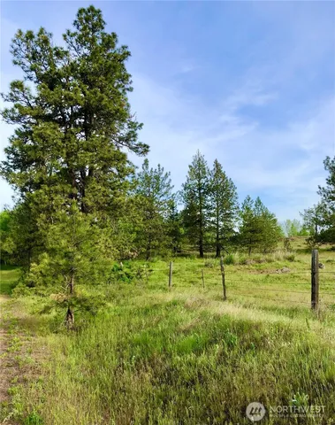 a view of a hallway with wooden walls