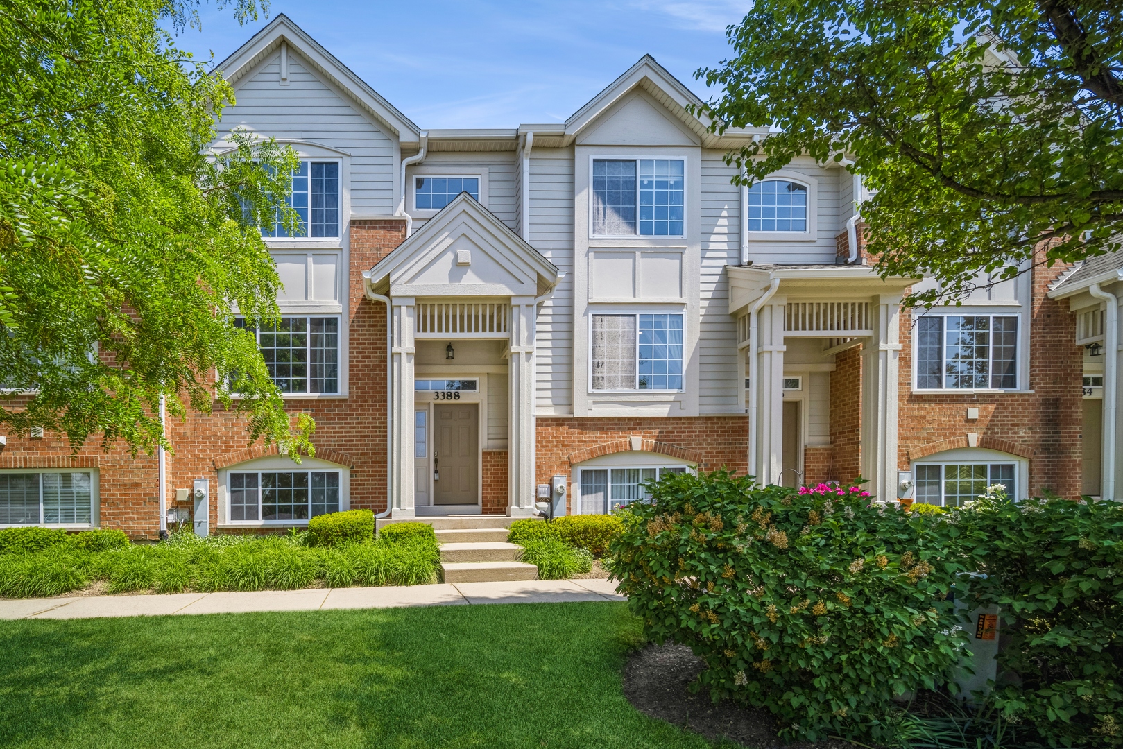 3388 Sanctuary Drive Elgin, IL 60124 - Photo 1 of 15 a front view of a house with a yard