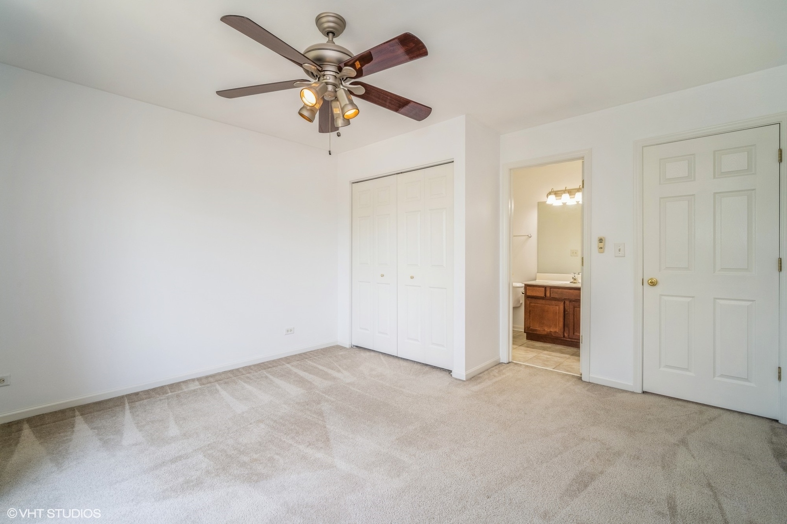 3388 Sanctuary Drive Elgin, IL 60124 - Photo 12 of 15 an empty room with a ceiling fan and a window