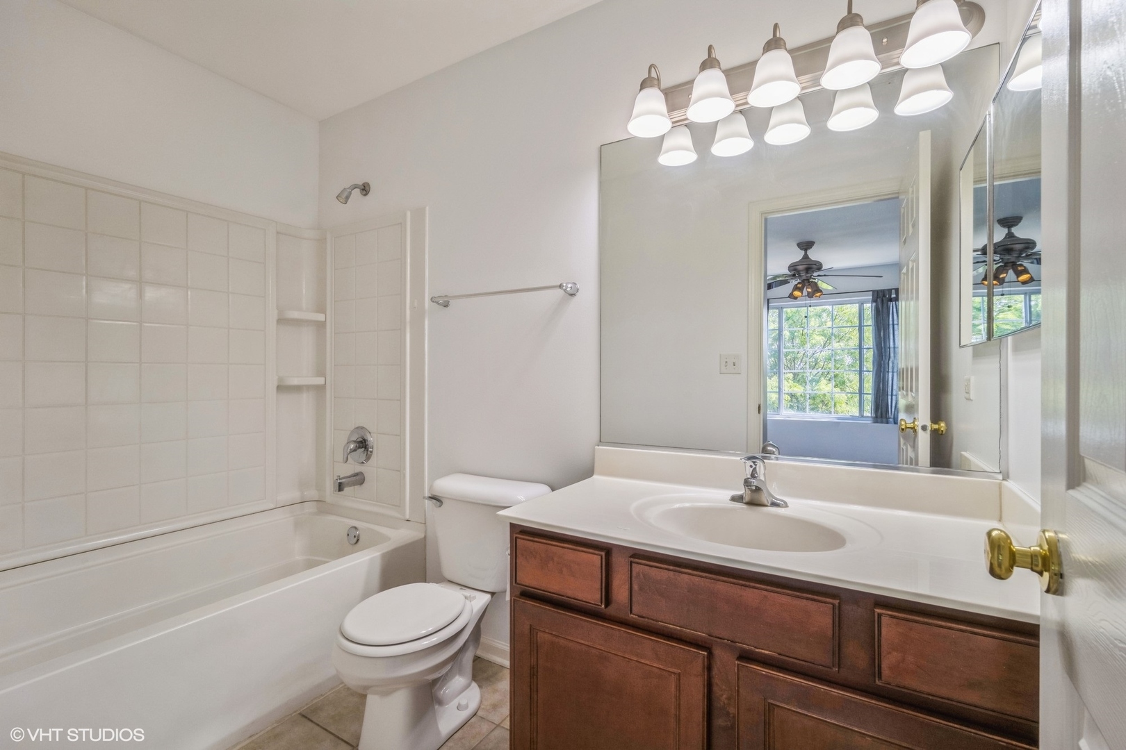 3388 Sanctuary Drive Elgin, IL 60124 - Photo 13 of 15 a bathroom with a sink a toilet and shower