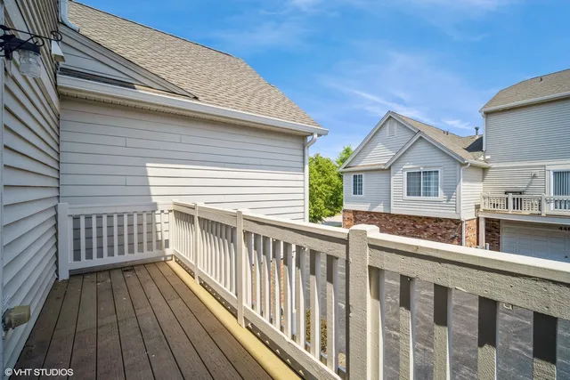 a view of a house with wooden deck