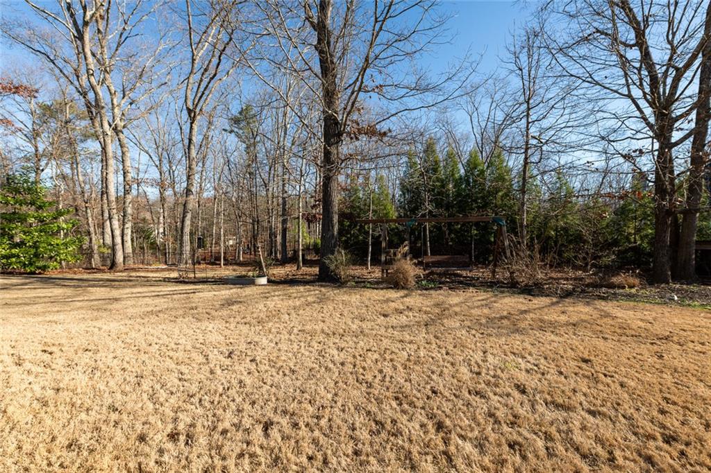8620 Copperridge Drive Winston, GA 30187 - Photo 17 of 45 a view of a house with a yard covered in snow