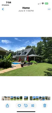a view of a big yard with an outdoor space