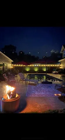 a view of a yard with an outdoor space