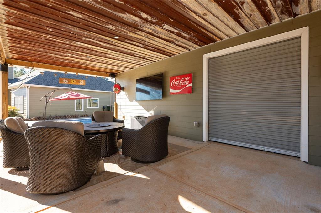 8620 Copperridge Drive Winston, GA 30187 - Photo 24 of 45 a outdoor living space with patio furniture and a potted plant