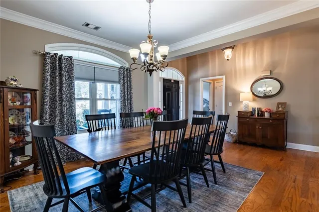 a view of a dining room with furniture and window