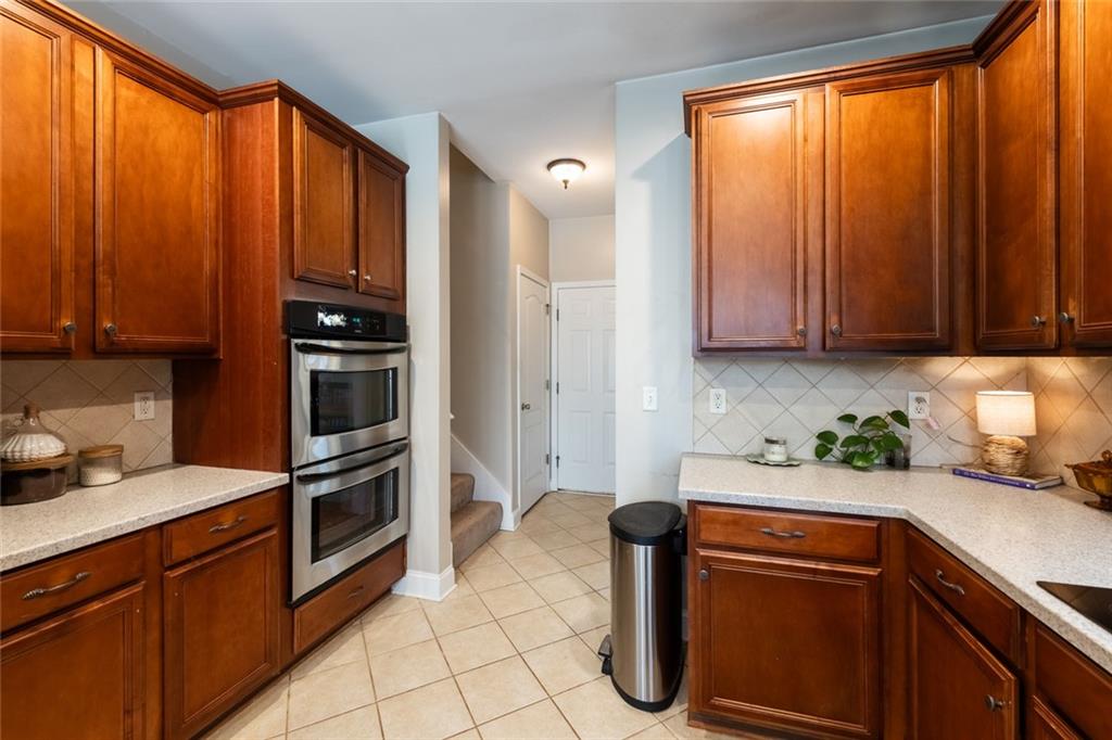 8620 Copperridge Drive Winston, GA 30187 - Photo 32 of 45 a kitchen with stainless steel appliances granite countertop a refrigerator and sink
