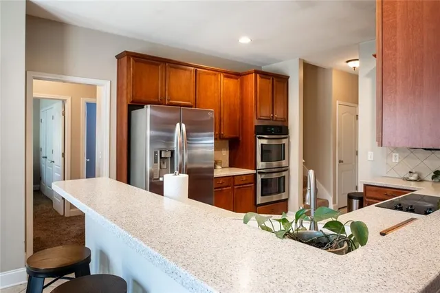 a bedroom with a bed and a large mirror