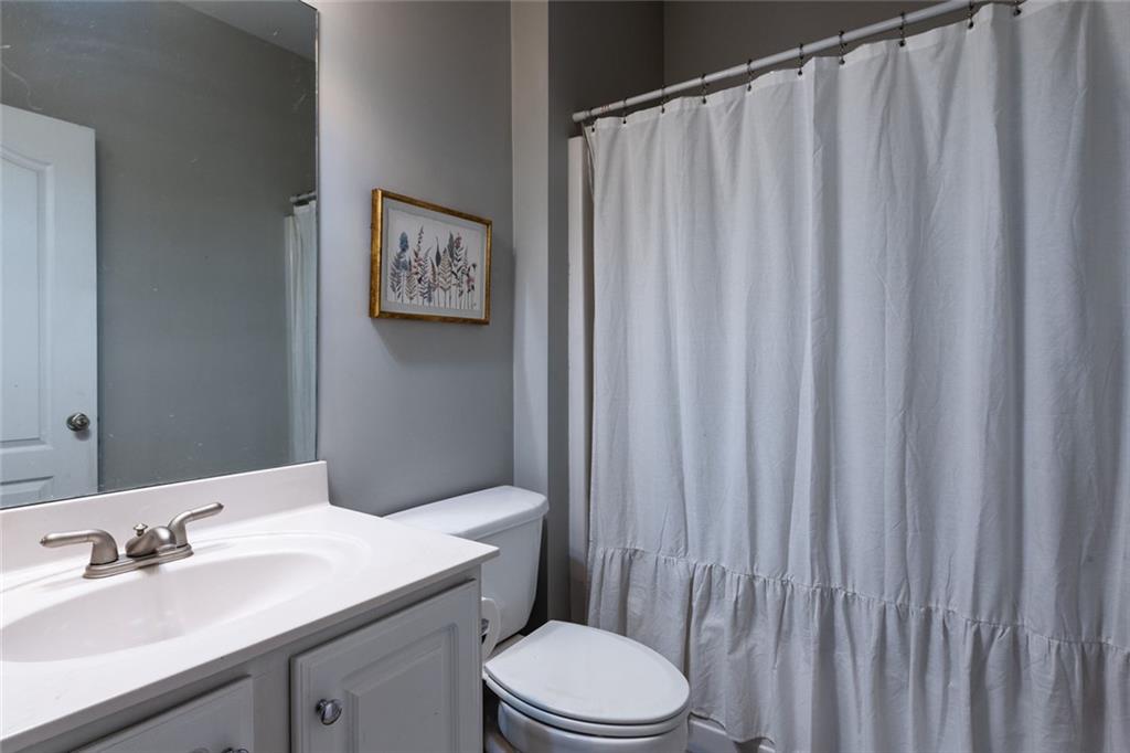 8620 Copperridge Drive Winston, GA 30187 - Photo 37 of 45 a bathroom with a sink a toilet and shower