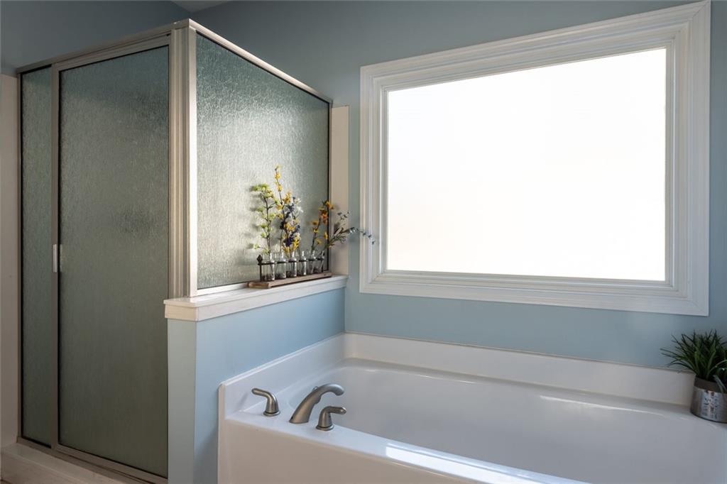 8620 Copperridge Drive Winston, GA 30187 - Photo 43 of 45 a bathroom with a bathtub and a shower