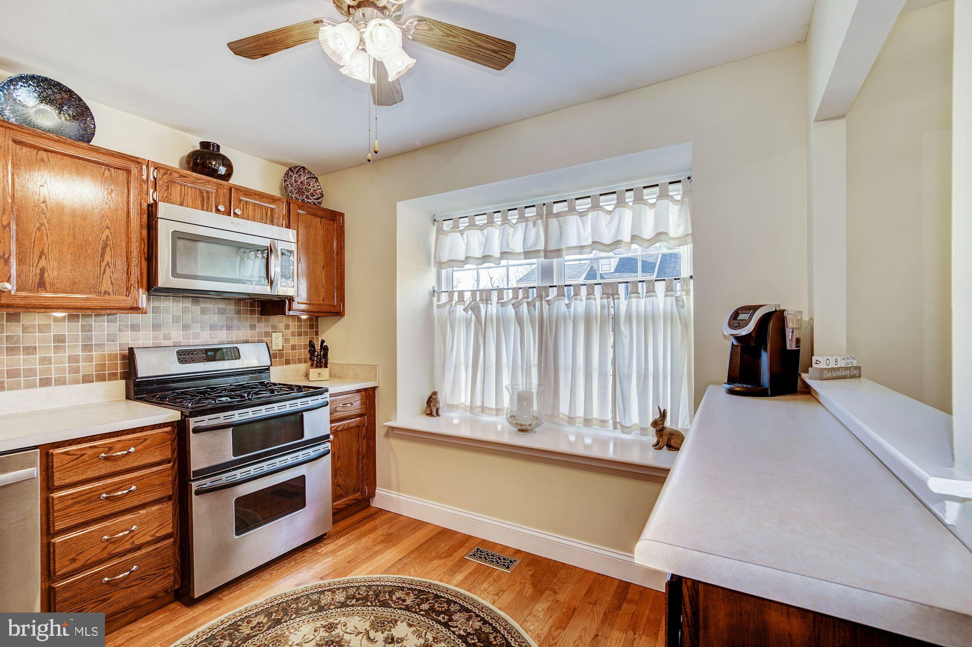 353 Scola Road Brookhaven, PA 19015 - Photo 11 of 26 Kitchen w/ Naural Light, Ceiling Fan