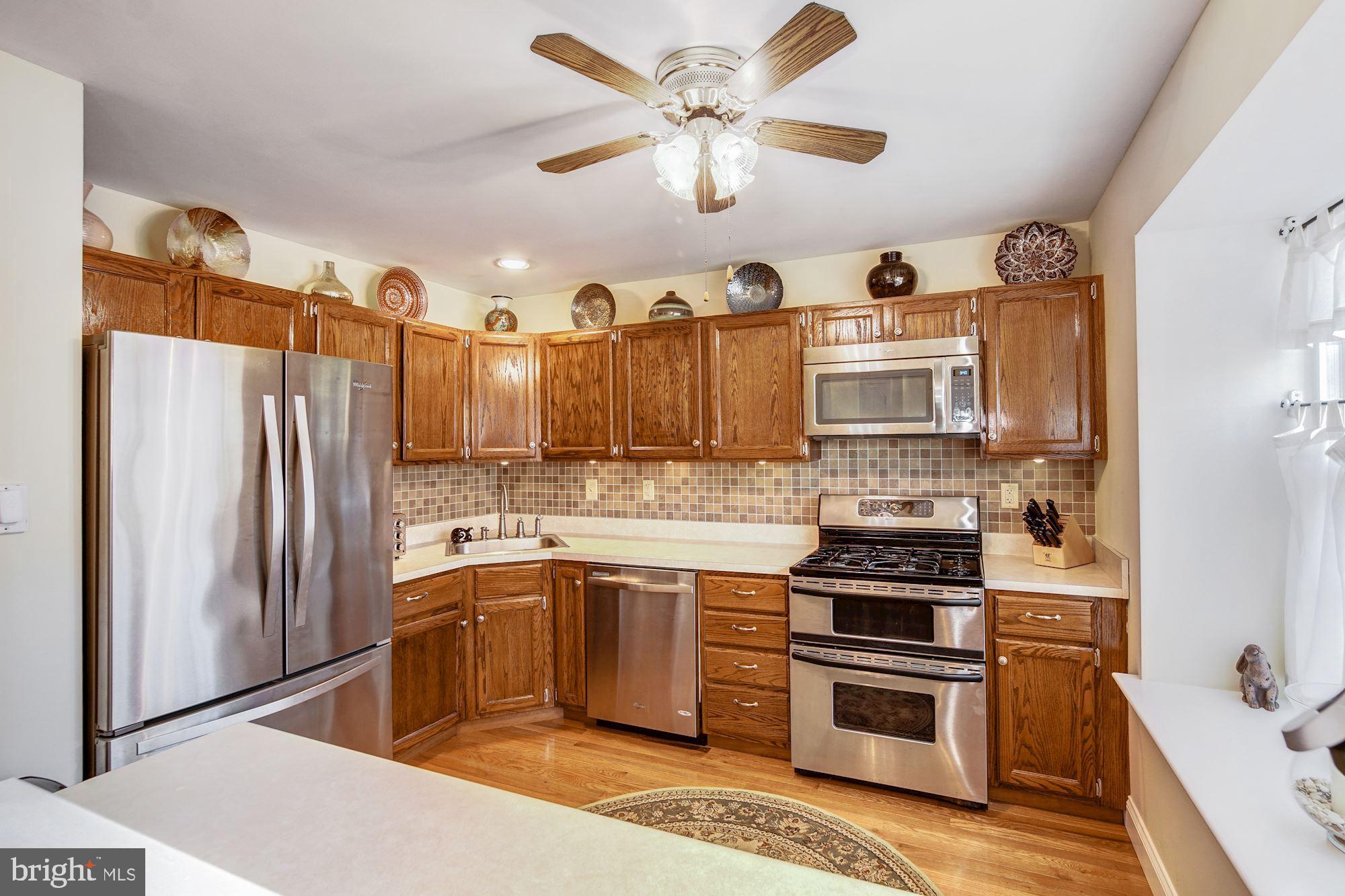 353 Scola Road Brookhaven, PA 19015 - Photo 9 of 26 Kitchen with Tile Backsplash
