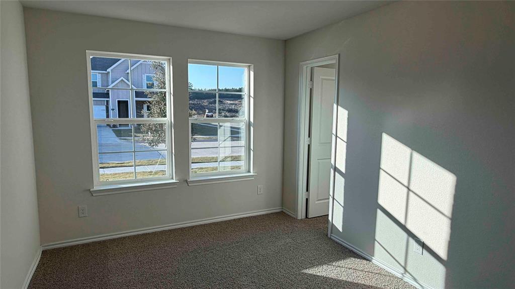 1550 Brooke Drive Tyler, TX 75704 - Photo 5 of 17 an empty room with windows and closet