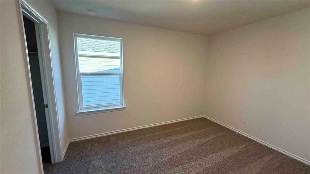 1550 Brooke Drive Tyler, TX 75704 - Photo 6 of 17 an empty room with a window