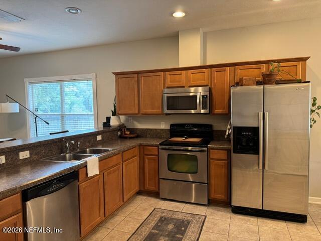 5410 Turkey Creek Road Jacksonville, FL 32244 - Photo 16 of 48 a kitchen with stainless steel appliances granite countertop a stove a sink dishwasher a refrigerator and a microwave