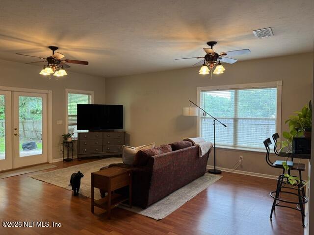 5410 Turkey Creek Road Jacksonville, FL 32244 - Photo 25 of 48 a living room with furniture a ceiling fan a flat screen tv and a large window