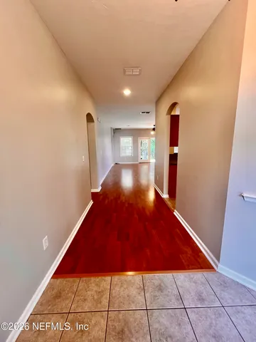 a kitchen with stainless steel appliances granite countertop a stove a sink dishwasher a refrigerator and a microwave