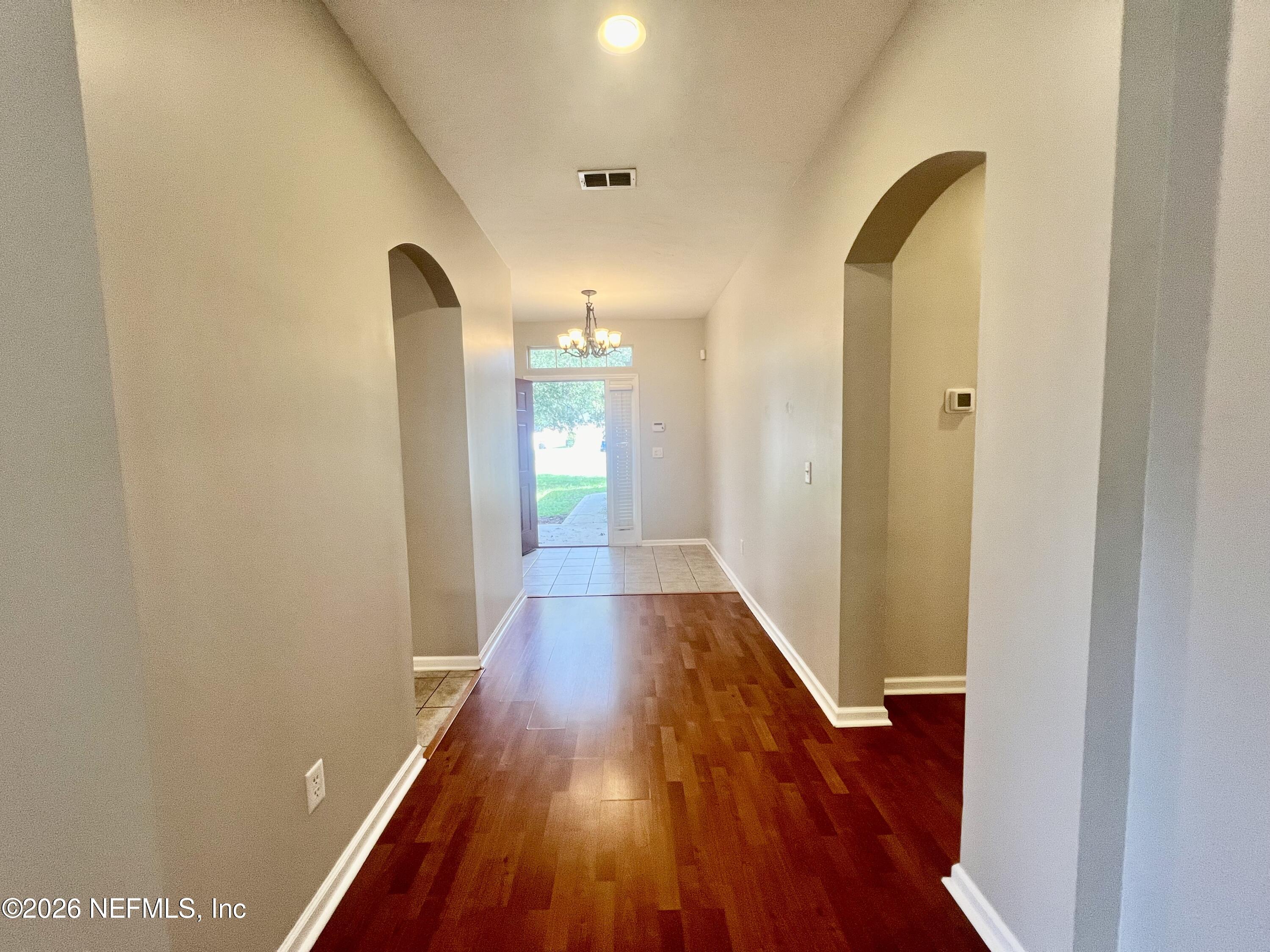 5410 Turkey Creek Road Jacksonville, FL 32244 - Photo 6 of 48 a view of a hallway with wooden floor