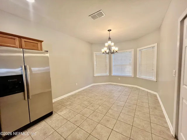 a bathroom with a bath tub with a shower
