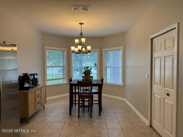 5410 Turkey Creek Road Jacksonville, FL 32244 - Photo 9 of 48 a view of a dining room with furniture and chandelier
