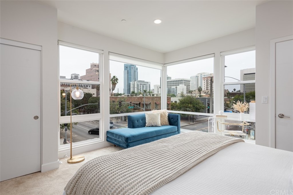 201 Elm Avenue Long Beach, CA 90802 - Photo 1 of 23 a bedroom with a large bed and a large window