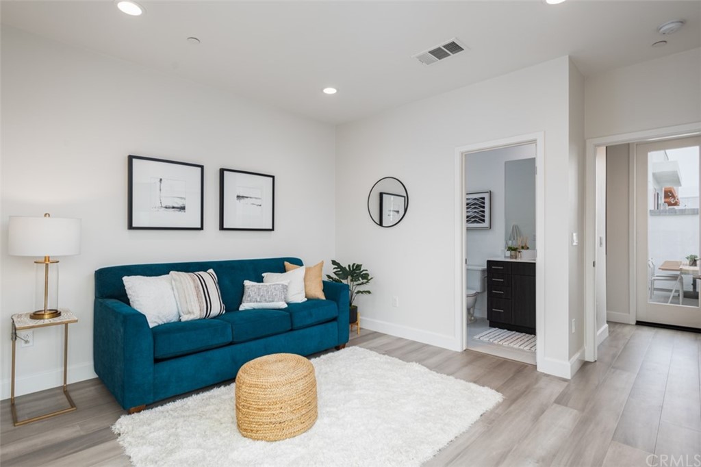 201 Elm Avenue Long Beach, CA 90802 - Photo 15 of 23 a living room with furniture and a wooden floor