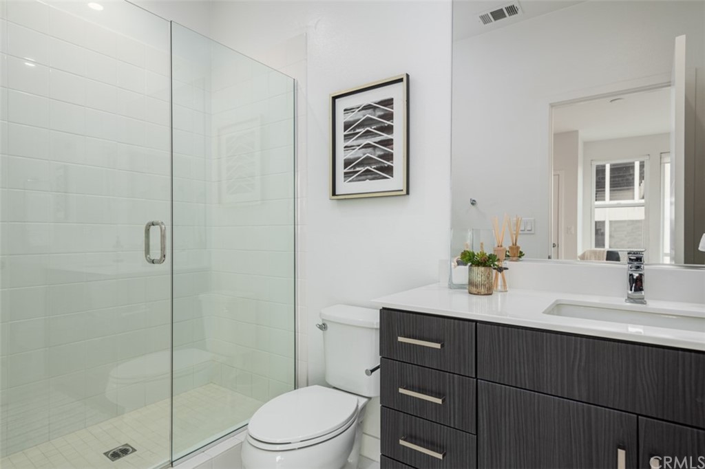 201 Elm Avenue Long Beach, CA 90802 - Photo 16 of 23 a bathroom with a toilet a sink and shower