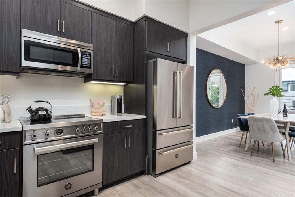 201 Elm Avenue Long Beach, CA 90802 - Photo 5 of 23 a kitchen with a stove a microwave and refrigerator