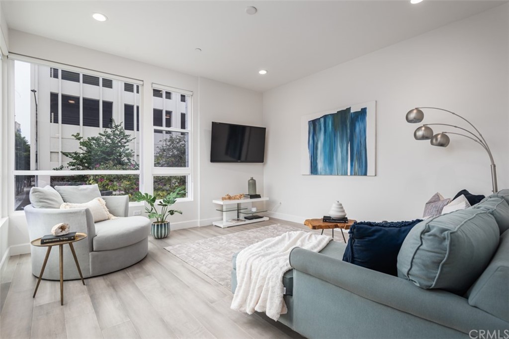 201 Elm Avenue Long Beach, CA 90802 - Photo 6 of 23 a living room with furniture and a flat screen tv