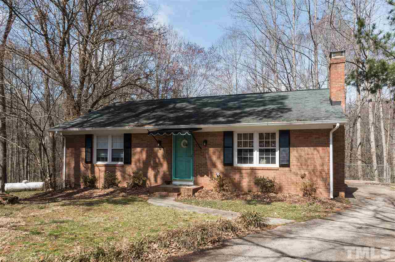 1108 Mockingbird Drive Raleigh, NC 27615 - Photo 1 of 21 a front view of a house with garden