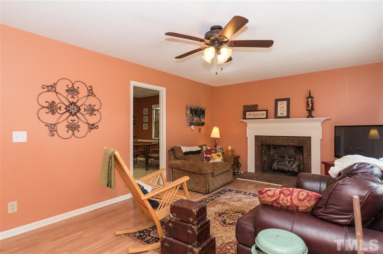 1108 Mockingbird Drive Raleigh, NC 27615 - Photo 2 of 21 a living room with furniture and a fireplace