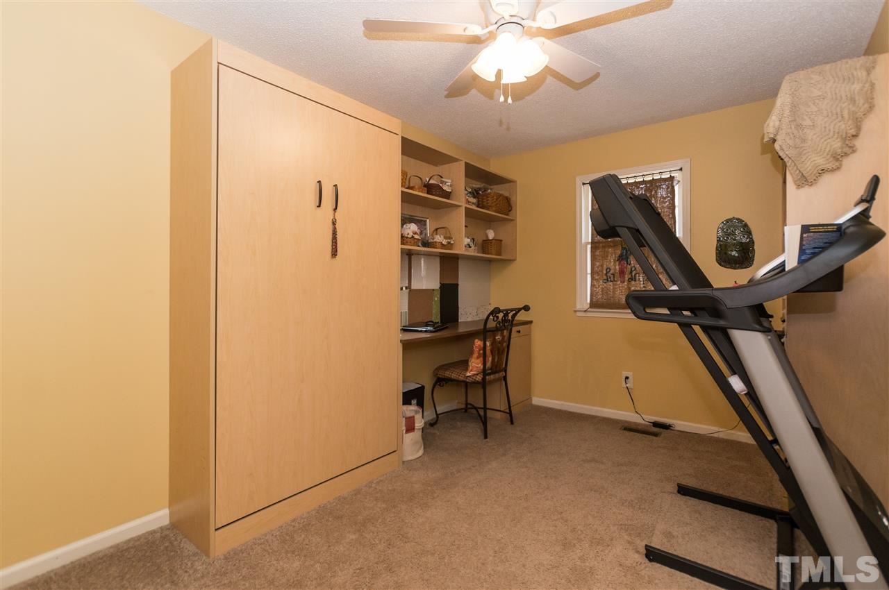 1108 Mockingbird Drive Raleigh, NC 27615 - Photo 14 of 21 a view of a room with gym equipment