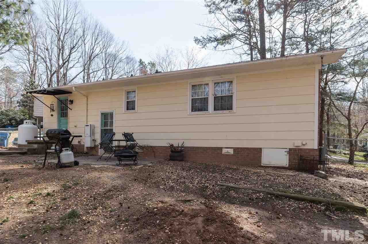 1108 Mockingbird Drive Raleigh, NC 27615 - Photo 20 of 21 a view of a house with a backyard and chairs