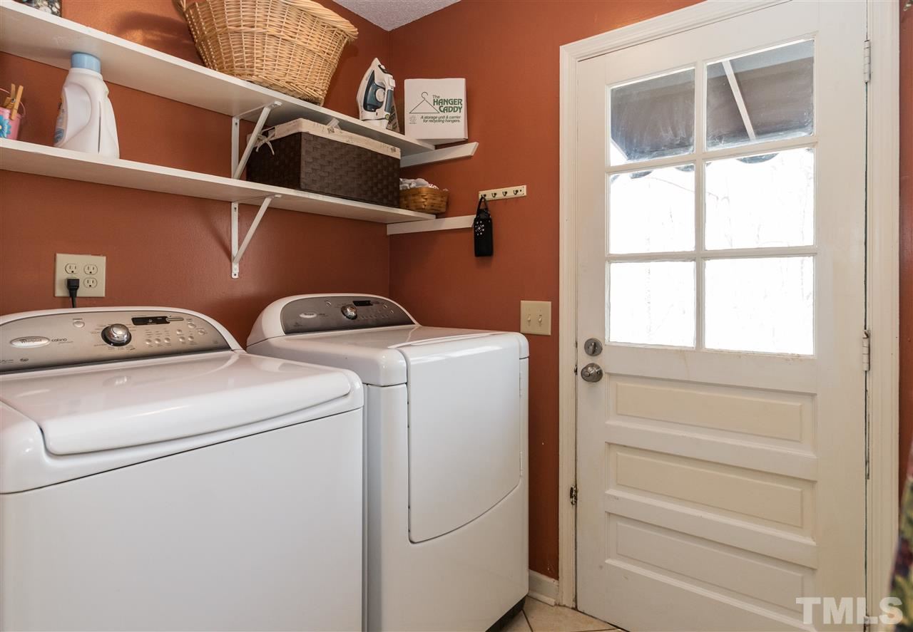 1108 Mockingbird Drive Raleigh, NC 27615 - Photo 9 of 21 a utility room with dryer and washer