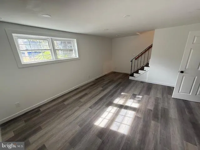 a view of entryway with wooden floor