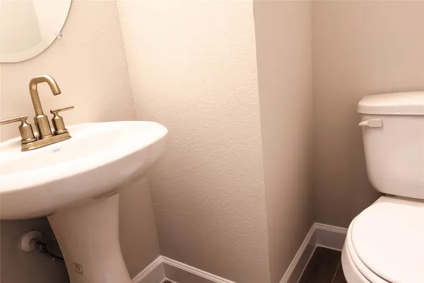 a bathroom with a sink a toilet