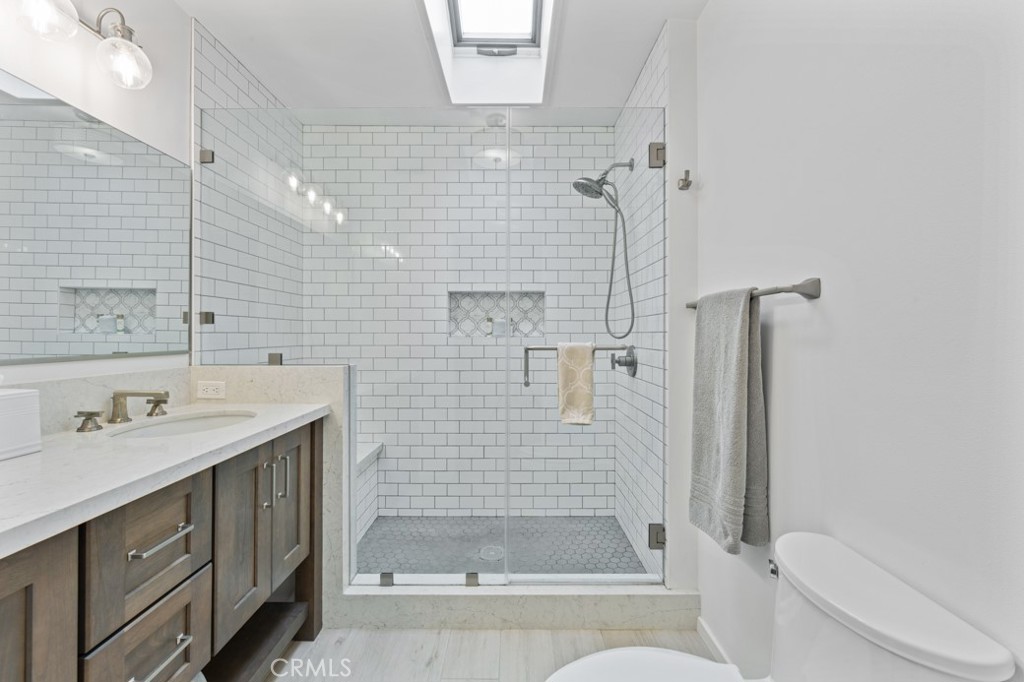 4425 Walnut Avenue Long Beach, CA 90807 - Photo 14 of 50 a bathroom with a sink a toilet and shower