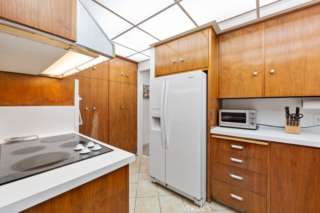 4425 Walnut Avenue Long Beach, CA 90807 - Photo 20 of 50 a kitchen with stainless steel appliances a refrigerator and a stove