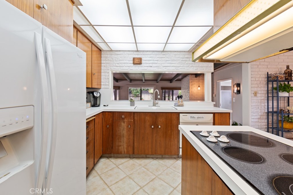 4425 Walnut Avenue Long Beach, CA 90807 - Photo 24 of 50 a kitchen with a stove and a refrigerator
