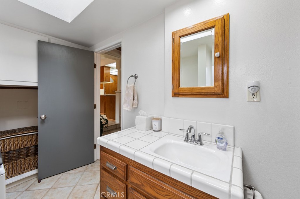 4425 Walnut Avenue Long Beach, CA 90807 - Photo 26 of 50 a bathroom with a sink and a mirror