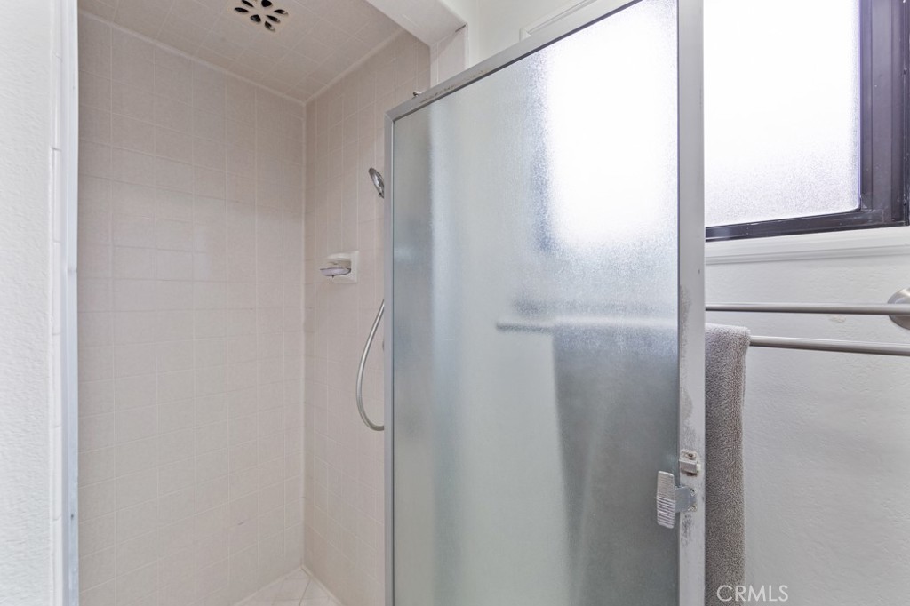 4425 Walnut Avenue Long Beach, CA 90807 - Photo 27 of 50 a bathroom with a glass shower door