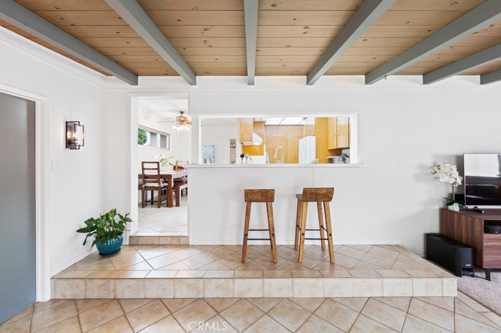 4425 Walnut Avenue Long Beach, CA 90807 - Photo 28 of 50 a view of a hallway with wooden floor and furniture