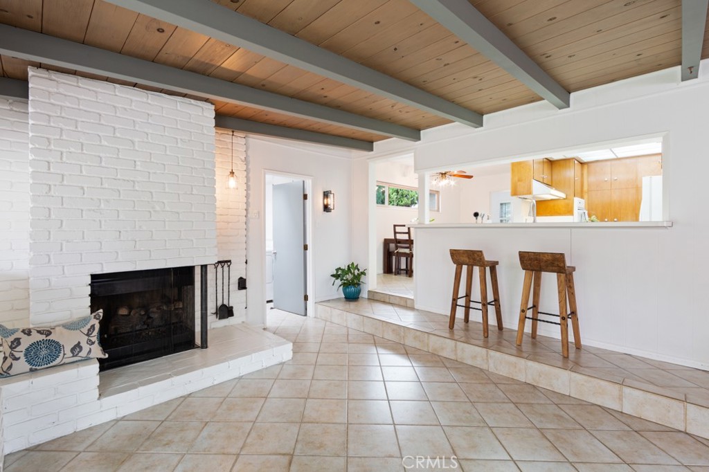 4425 Walnut Avenue Long Beach, CA 90807 - Photo 35 of 50 a living room with furniture a fireplace and a flat screen tv