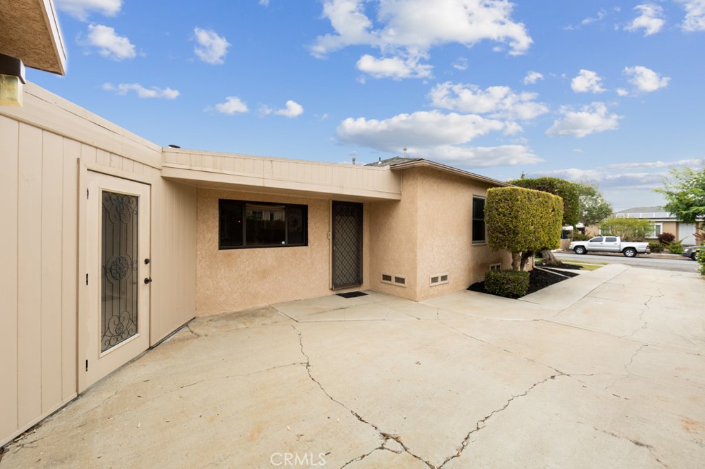 4425 Walnut Avenue Long Beach, CA 90807 - Photo 39 of 50 a view of a patio with table and chairs and potted plants
