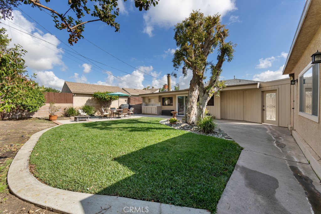 4425 Walnut Avenue Long Beach, CA 90807 - Photo 42 of 50 a front view of a house with garden