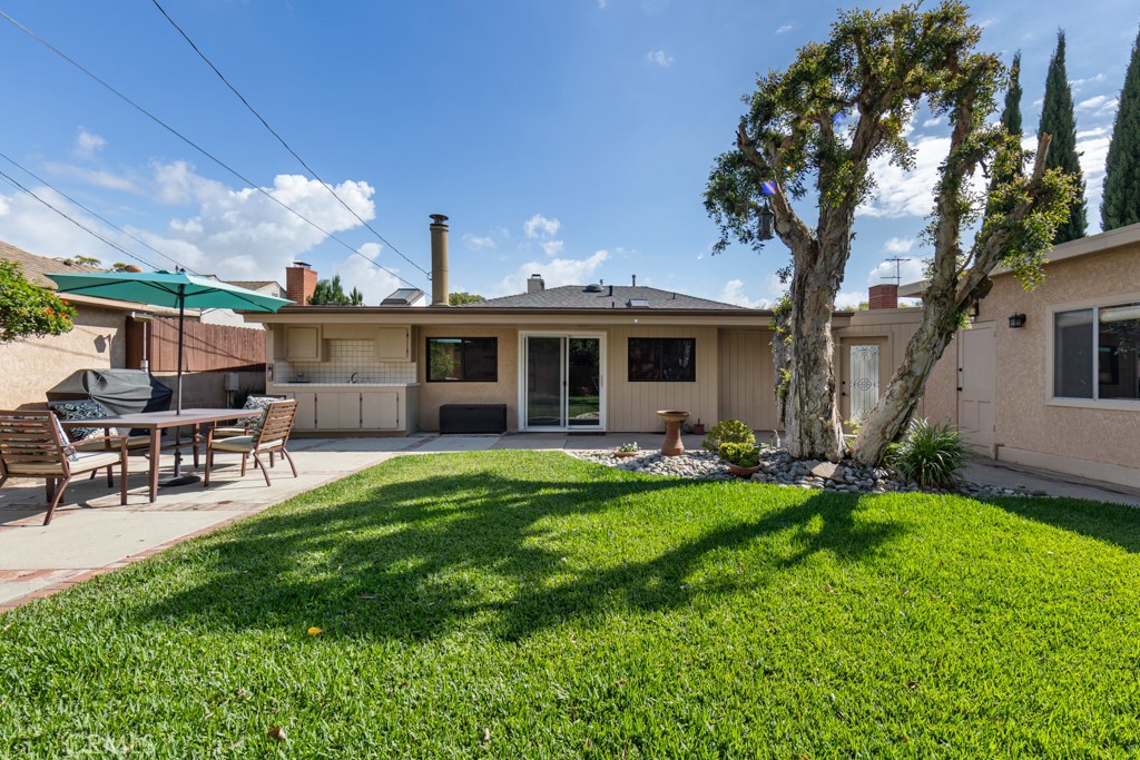 4425 Walnut Avenue Long Beach, CA 90807 - Photo 45 of 50 a view of a house with a yard porch and sitting area