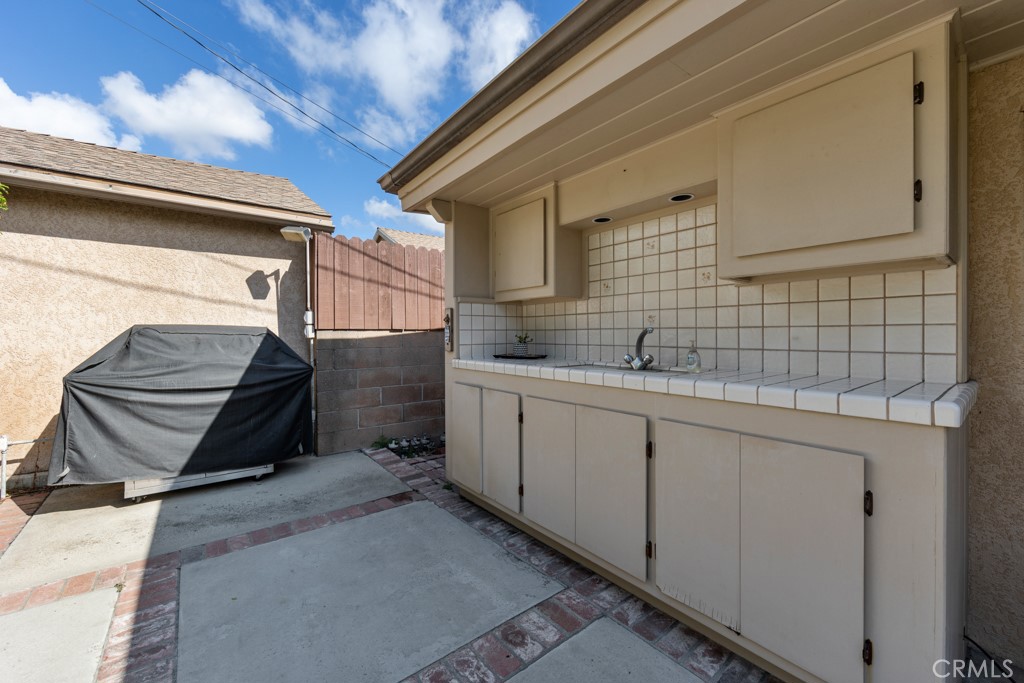 4425 Walnut Avenue Long Beach, CA 90807 - Photo 47 of 50 a utility room with cabinets
