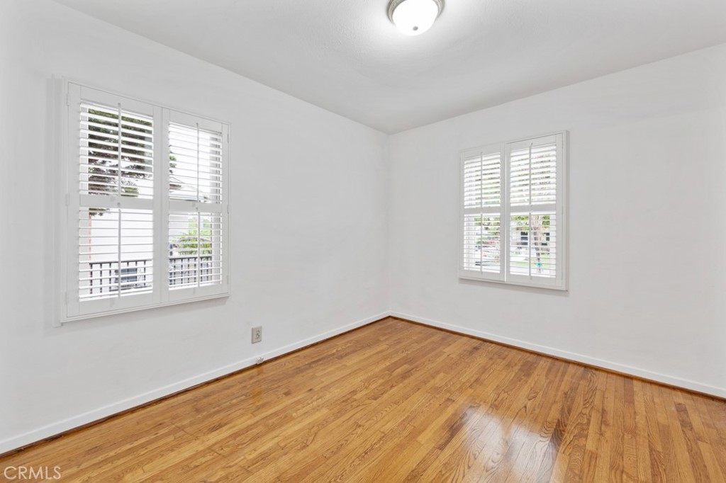 4425 Walnut Avenue Long Beach, CA 90807 - Photo 6 of 50 a view of an empty room with wooden floor and a window