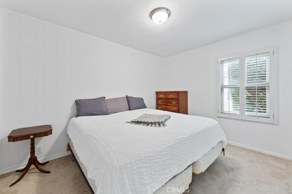 4425 Walnut Avenue Long Beach, CA 90807 - Photo 8 of 50 a bedroom with a bed and a window